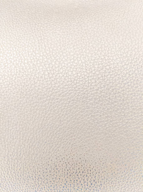 istock A captivating closeup reveals the soft, subtle texture of pearl leather. 2194405751