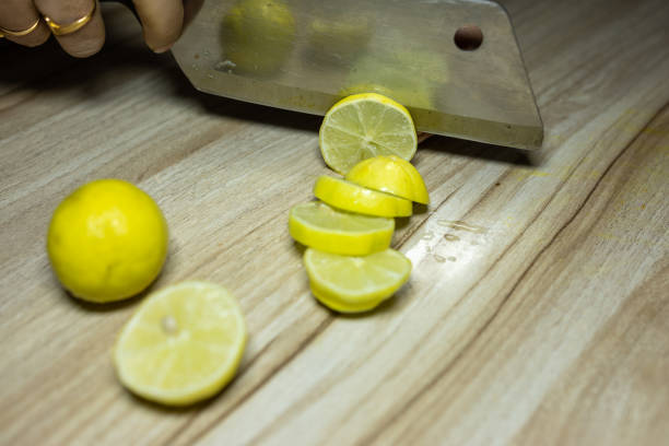 Pile of fresh lemon slices on blue plate