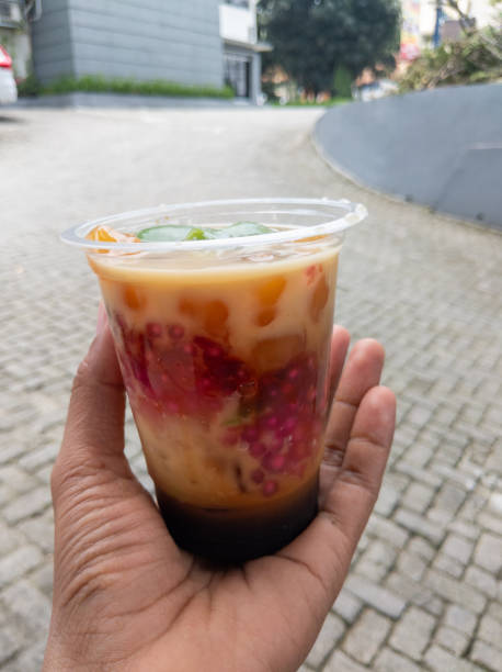 istock A refreshing layered dessert drink with vibrant red and orange pearls, 2194409875