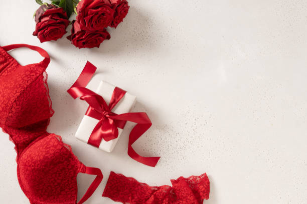 istock Valentine's day frame. Red lace bustier underwear, candy sweets and red roses 2194409942