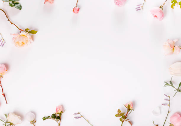 istock Festive flower composition on the white wooden background. Overhead view 2194419468