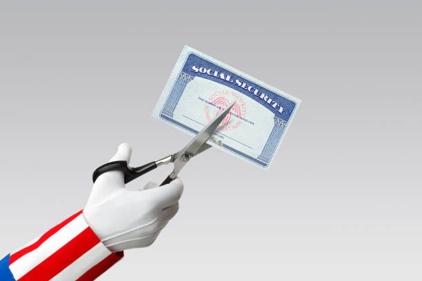 Social Security Cuts Uncle Sam about to cut a Social Security card. uncle sam broke stock pictures, royalty-free photos & images