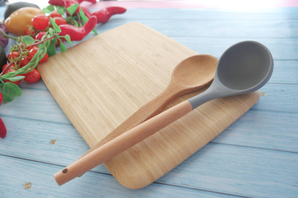 istock Discover elegant wooden cooking utensils beautifully placed on a bamboo cutting board 2194421886
