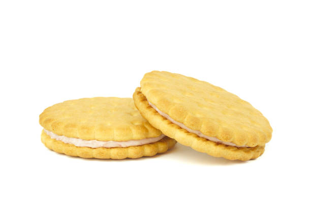 Sandwich cookies, green cream filled biscuits isolated on white background, full depth of field