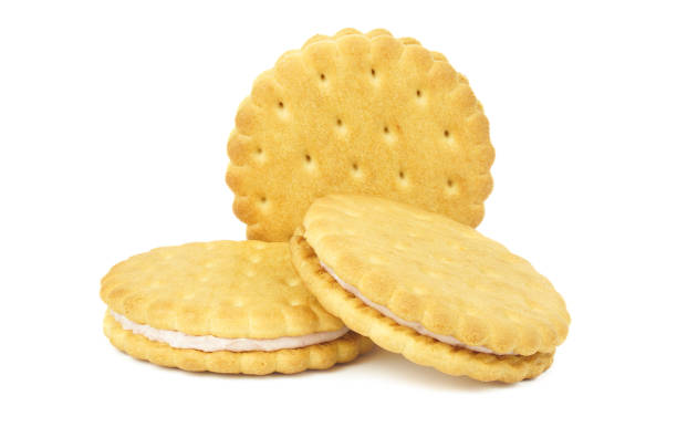 Sandwich cookies, green cream filled biscuits isolated on white background, full depth of field