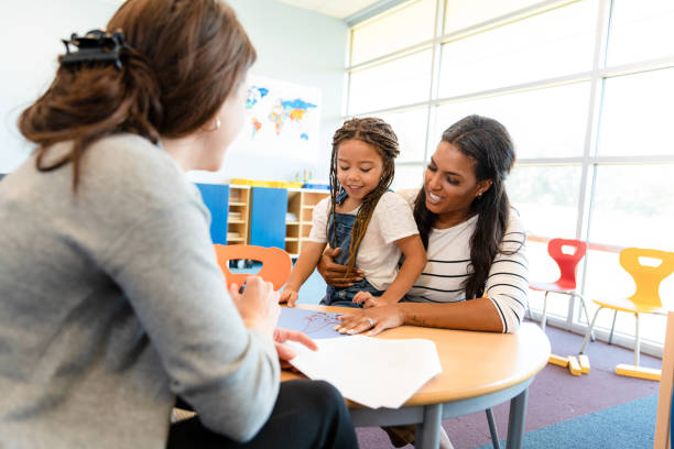istock Mother and Daughter Working Together in a Classroom 2194423028