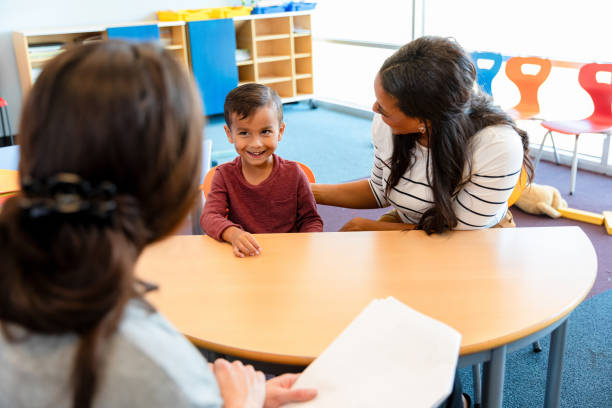 istock Elementary School Child Meeting with Teacher and Parent 2194423039