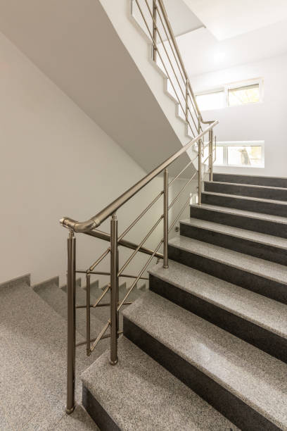 istock Modern stair case between floors. Stairs with metallic rail  in modern building 2194423249