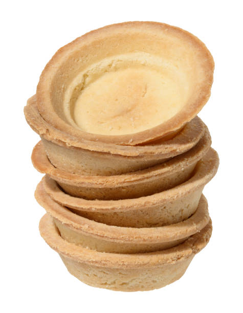 istock Stack of empty tartlets for salads and filling on isolated background 2194427645
