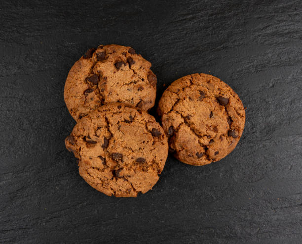 istock Chocolate chips pile cookies , American biscuits, cocoa confectionery cake, sweet morsels bakery 2194429751