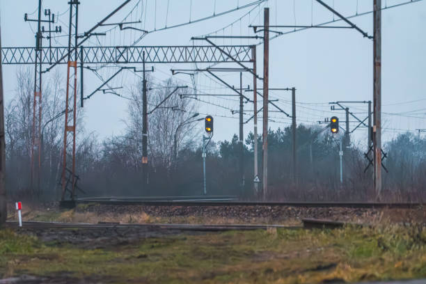 istock railway infrastructure in the morning. traction network and semaphores 2194430164