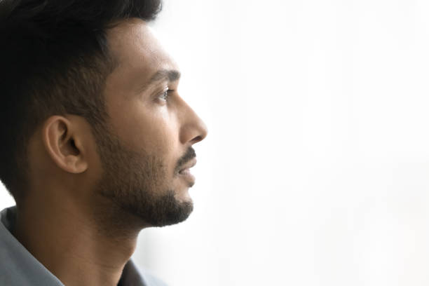 istock Close up profile face of pensive handsome Indian man 2194431260