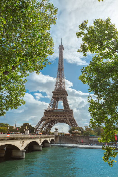 istock Paris Eiffel Tower With Bridge And Lush Green Foliage On A Sunny Day 2194431983