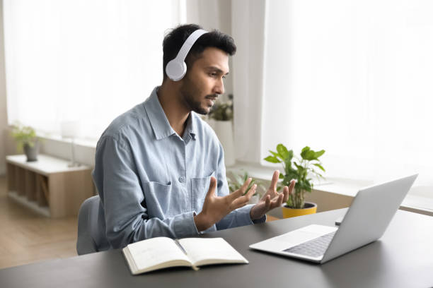 istock Serious Indian man lead online communication using laptop and videocall 2194432752