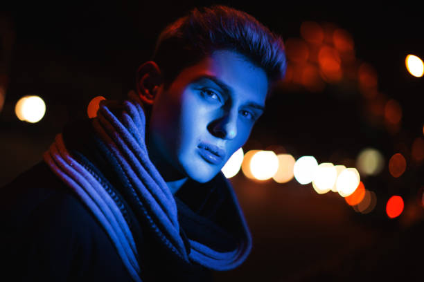 istock Stylish Young Man In Dramatic Blue Lighting At Night 2194433239