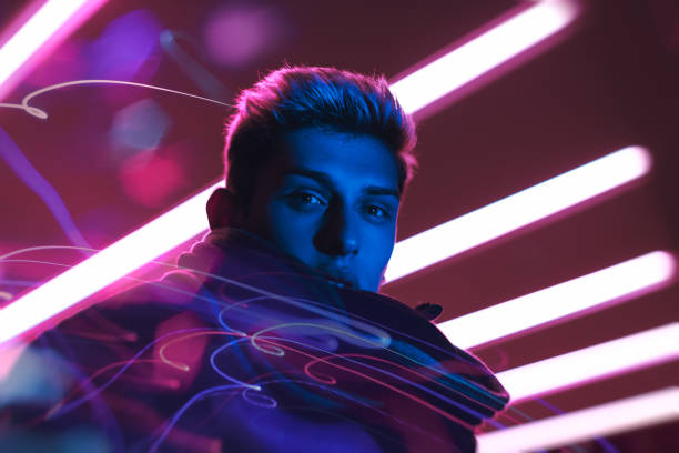 istock Trendy Man In Neon Lighting With Futuristic Vibes 2194433509