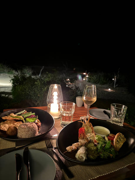 istock Seafood BBQ Dinner table in Yala Sri Lanka Beach front restaurant, eating prawns and squid 2194436443