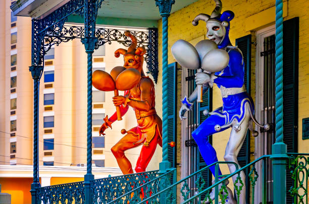 Mobile, Alabama, USA - Nov. 20, 2022: Mardi Gras jesters stand on the porch of the Mobile Carnival Museum in Mobile, Alabama. Mobile Carnival Museum opened in 2005 and is dedicated to the history of Mardi Gras.