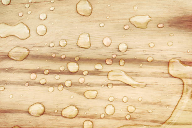 Close-up of fresh water drops on wooden surface