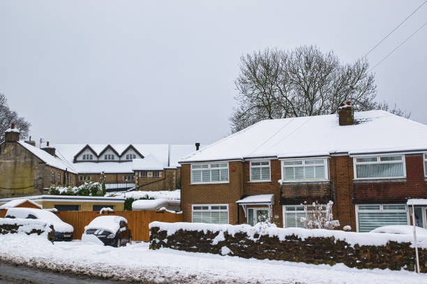 istock Snow-Covered Residential Homes and Vehicles in Harrogate, UK. 2194440872