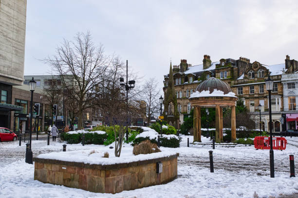 istock Snow-Covered Town Square with Gazebo and Buildings in Harrogate, UK. 2194441151