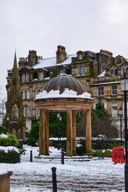 istock Snow-Covered Gazebo and Stone Building in Harrogate, UK. 2194441169