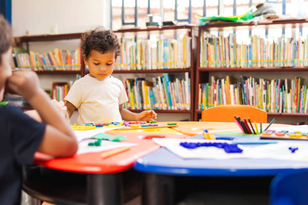 istock Children playing with colorful toys in library 2194441533