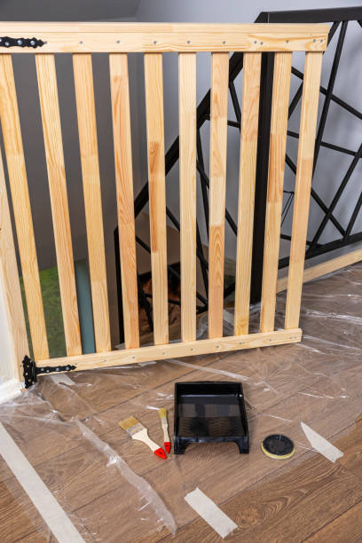 istock Wooden Safety Gate and Painting Tools in Home Improvement Setup 2194441749