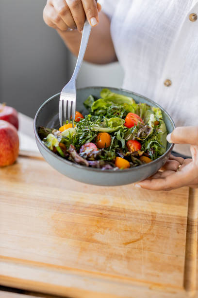 istock woman cooking health meal 2194442449