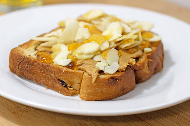 Toasted bread with natto and cherry tomatoes on a plate