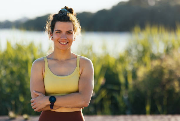 istock Confident Young Woman Posing Outdoors During a Bright Sunny Day 2194443745