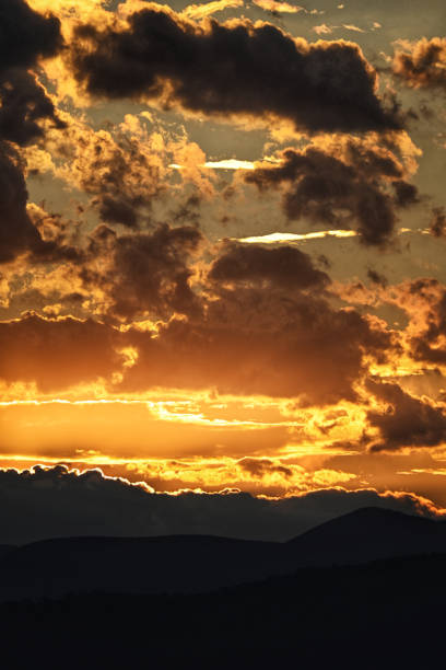 Colorful clouds in dramatic sunset sky