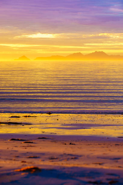 Seascape on Andoya island, beach seashore at midnight sun during summer, Vesteralen archipelago, Norway.