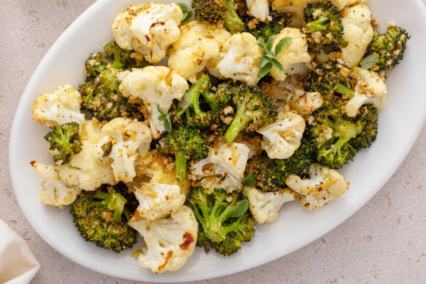istock Roasted cauliflower and broccoli on a serving plate, healthy vegetable side dish 2194445597