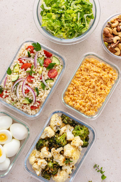 istock Healthy vegetarian meal prep with boiled eggs, roasted vegetables, cooked lentils, couscous salad and nuts 2194445620