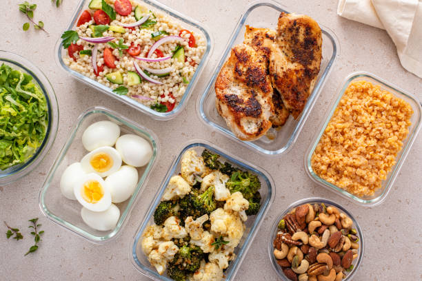 istock Healthy meal prep with cooked chicken breast, boiled eggs, roasted vegetables, cooked lentils, couscous salad and nuts 2194445621