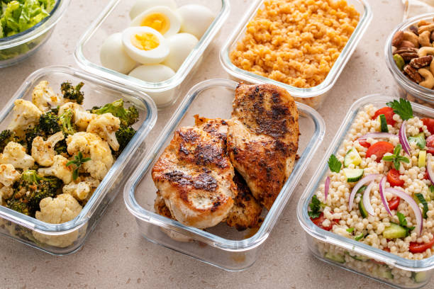 istock Healthy meal prep with cooked chicken breast, boiled eggs, roasted vegetables, cooked lentils, couscous salad and nuts 2194445624