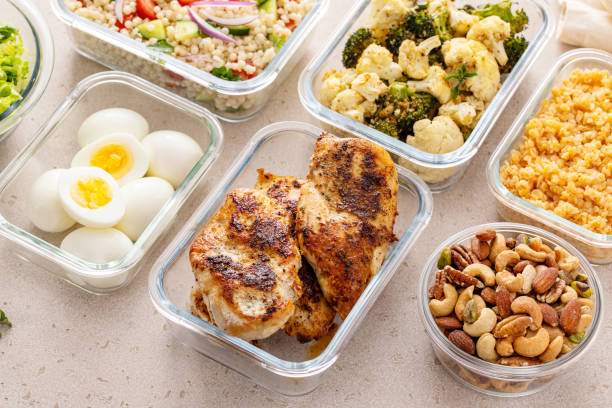 istock Healthy meal prep with cooked chicken breast, boiled eggs, roasted vegetables, cooked lentils, couscous salad and nuts 2194445627