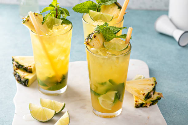 istock Pineapple mojito with mint and lime wedges garnished with mint leaves and pineapple slices 2194445657