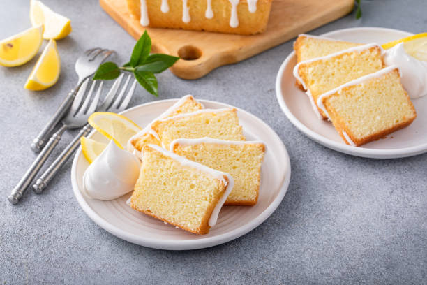 Lemon pound cake slices on a plate with whipped cream