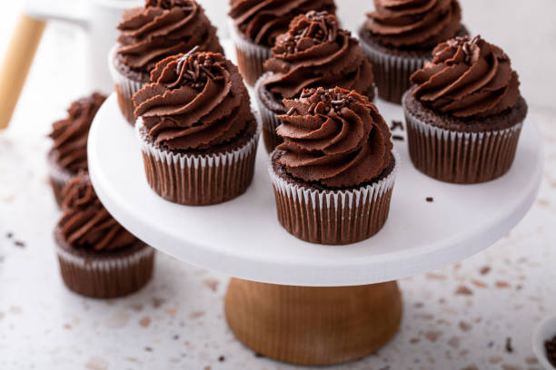 istock Chocolate cupcakes with chocolate ganache frosting and chocolate sprinkles 2194445695