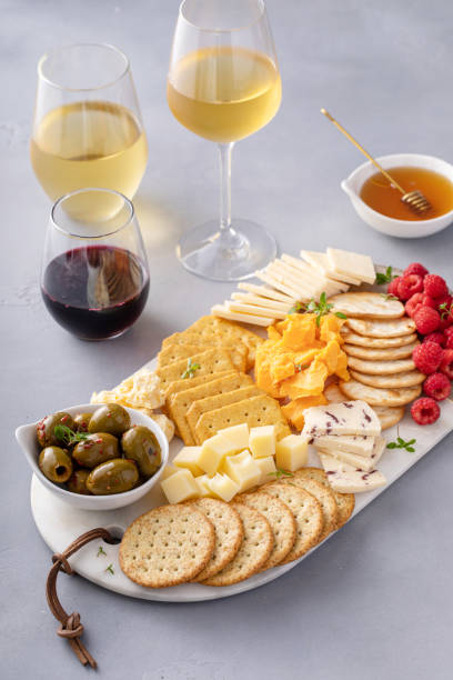 istock Cheese and snacks board with olives and crackers 2194445731