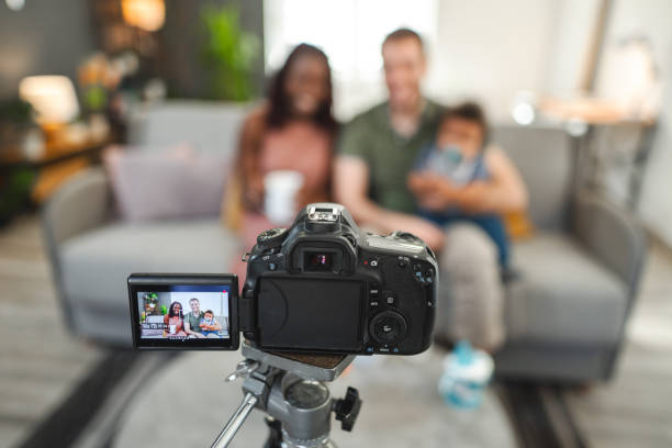 istock Multi-racial family recording video content at home 2194448174
