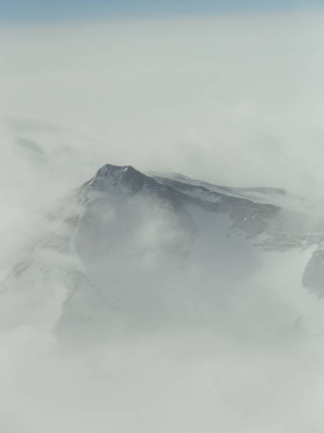istock Mountain peak through the fog 2194449827