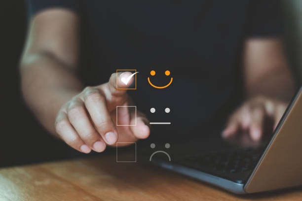 Customer service best excellent business rating experience. Satisfaction feedback survey concept. User touch the virtual happy smile face icon to give satisfaction in online service. Quality marketing