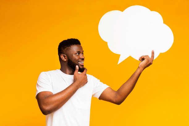 istock African-american man looking at blank speech bubble 2194460390