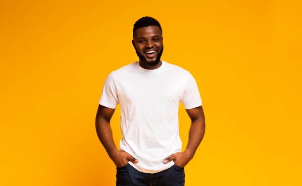 istock Positive african american man laughing with hands in pockets 2194460397