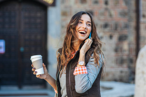 istock Beautiful woman talking on the phone 2194463178
