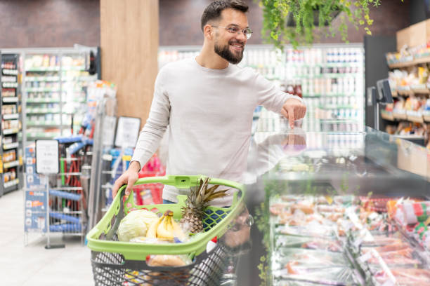 istock Handsome man shopping in supermarket 2194463187