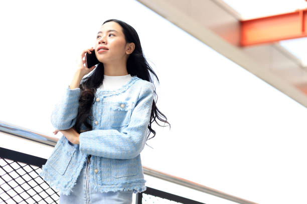 istock Asian Young Women using Smartphone for Making a Call 2194464373